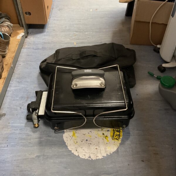 Weber Go Anywhere portable charcoal barbecue with carrying bag.