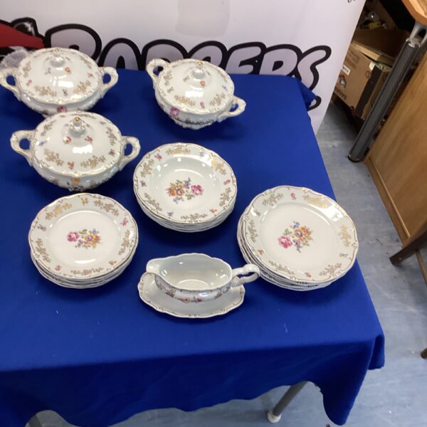 Vintage Weiman German porcelain dinner set with floral design.