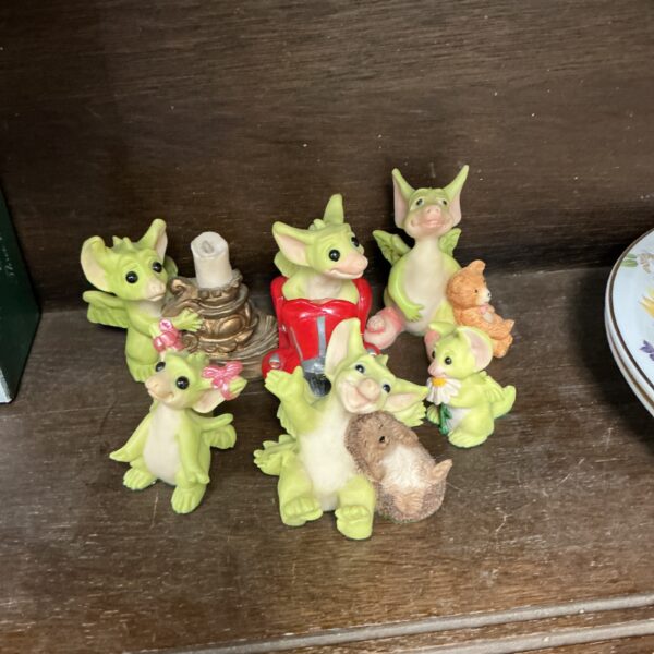 Colourful collection of whimsical dragon figurines for collectors.