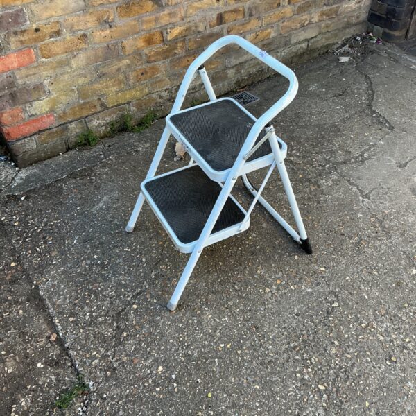 White aluminium kitchen step ladder for household use.