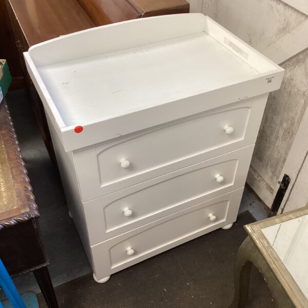 White three-drawer baby changing unit for nursery organisation.