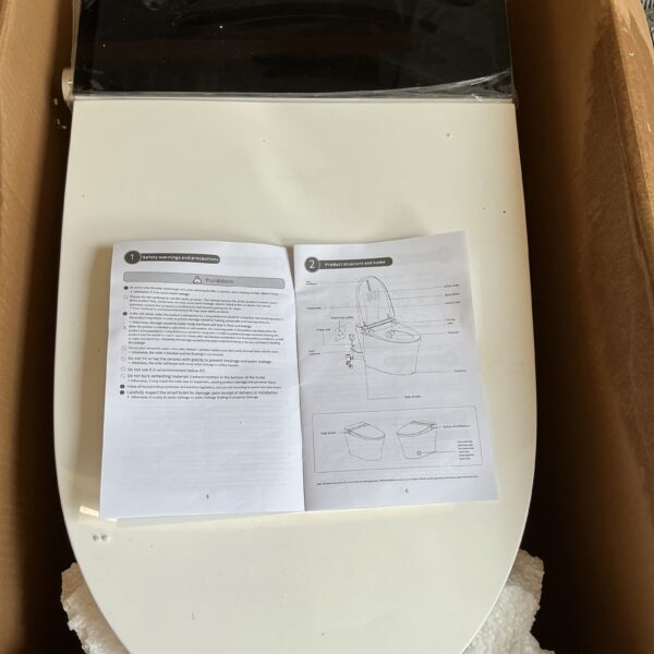 White smart toilet with fittings and instructions for installation.