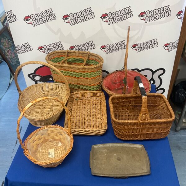 Assortment of six vintage wicker baskets for storage and display.