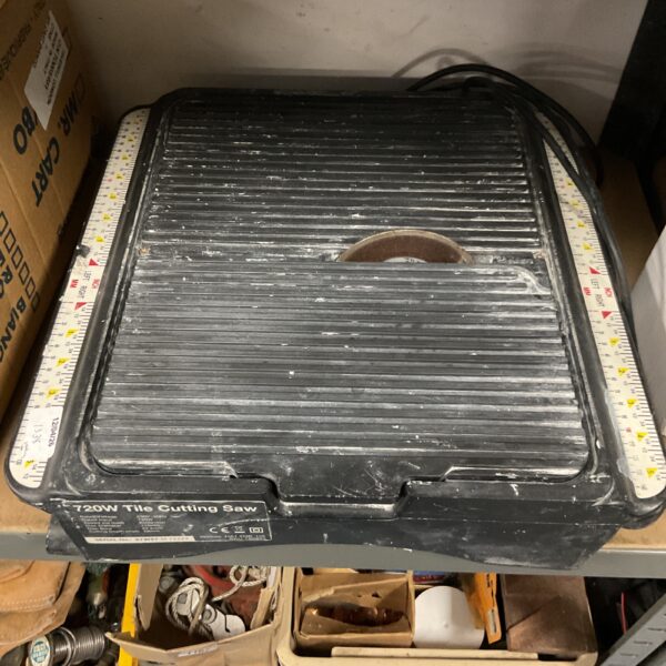 Used Wickes 730W tile cutting saw for DIY tiling projects.