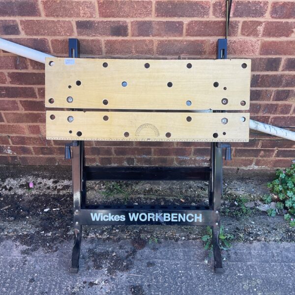 Portable Wickes workbench with folding legs for DIY projects.