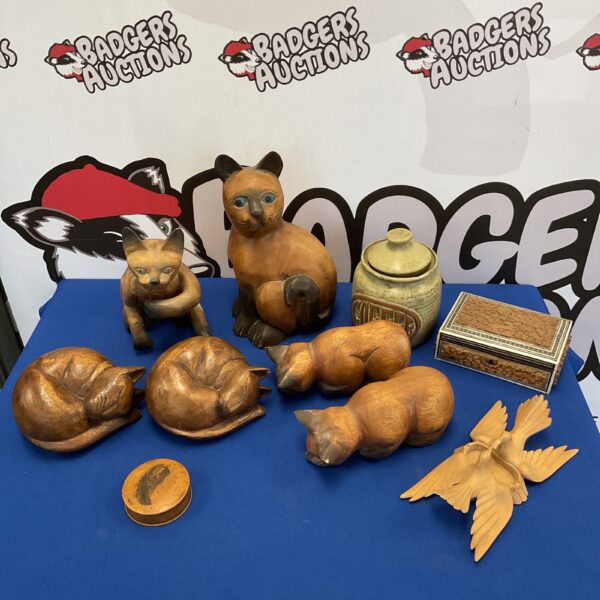 Vintage wooden cat collection with carved box and stoneware jar.