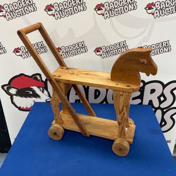 Vintage wooden children’s horse, a classic nursery toy.