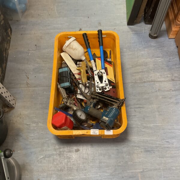 Assorted workshop tools including spray gun and nailer.