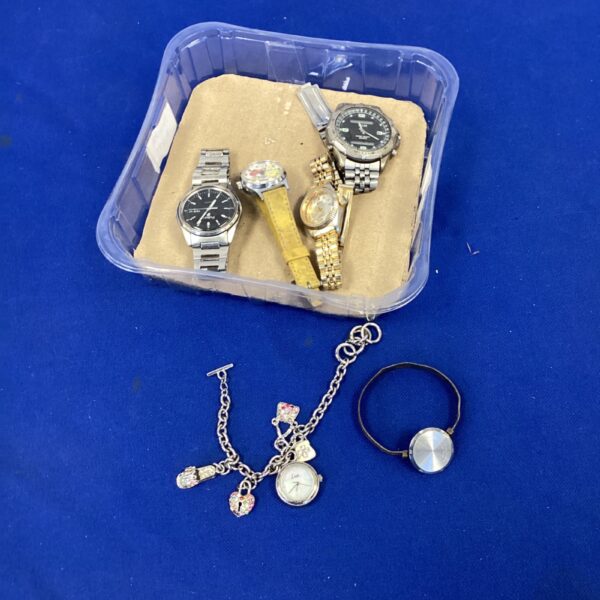 Assorted wrist watches and jewellery in a plastic tub.
