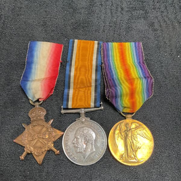 WW1 trio of medals awarded to Gnr Parker RFA, front view.