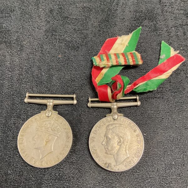 WWII War Medal Set with ribbons displayed, vintage military collectible.