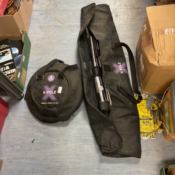 X Pole portable dance pole set in a carry bag.