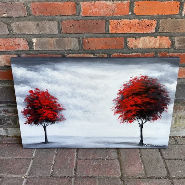 Vibrant red tree landscape painting by Xavier Leon.