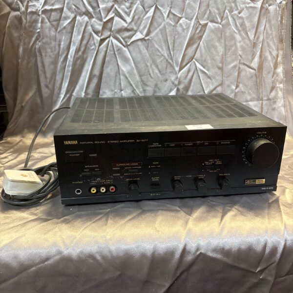 Front view of vintage Yamaha AV-M77 stereo amplifier.
