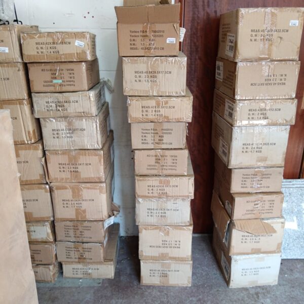 Stack of new Yankee Candle holder boxes, ready for display.