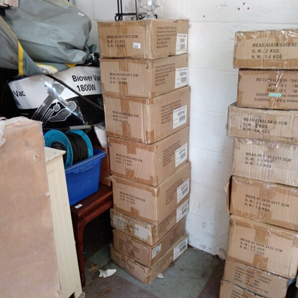 Stack of eight boxes of new Yankee Candle holders.