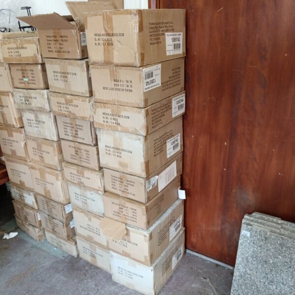 Stack of eight boxes of new Yankee Candle holders for home decor.