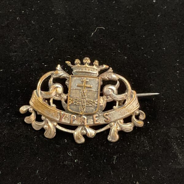 Vintage Ypres pin badge, WWI military collectable, detailed gilt finish.