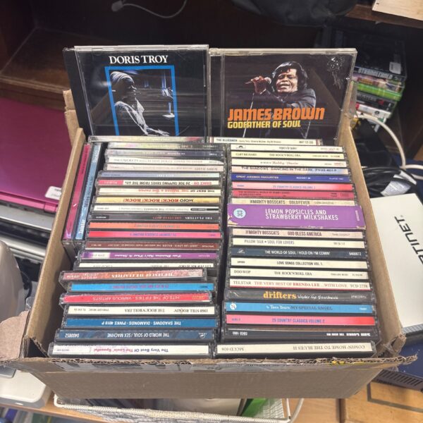 Vintage 60s rock ‘n’ roll CDs by James Brown and Doris Troy.