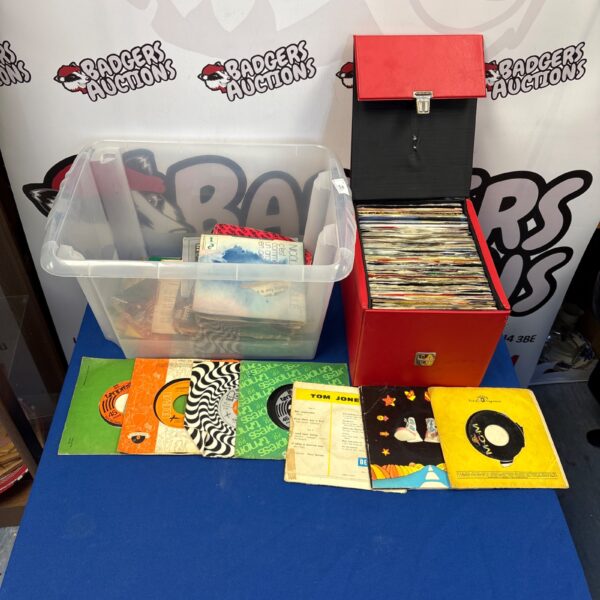 Collection of vintage 7 inch vinyl records including Tom Jones.