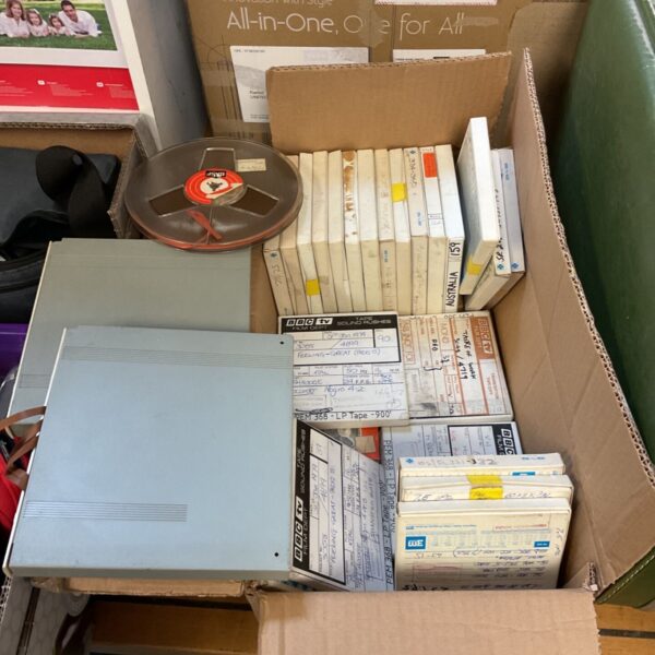 Vintage 8mm reel to reel tapes in a box.