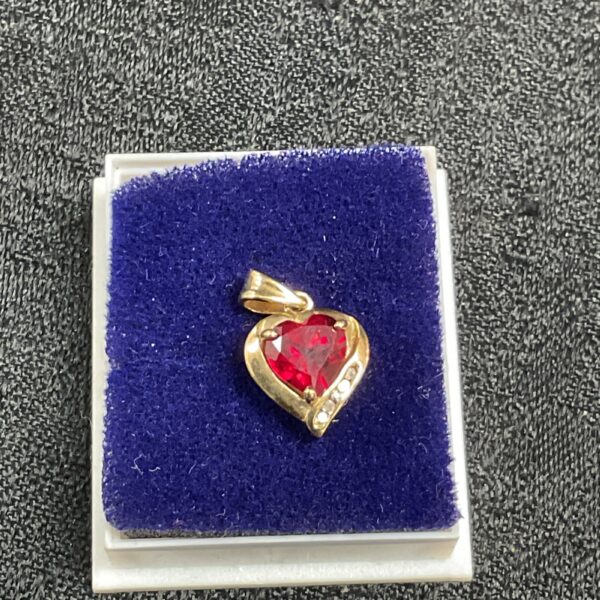 9ct gold heart pendant with red stone, elegant jewellery.