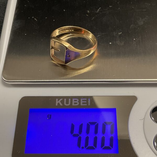 Close-up of 9ct gold ring scrap for melting down.