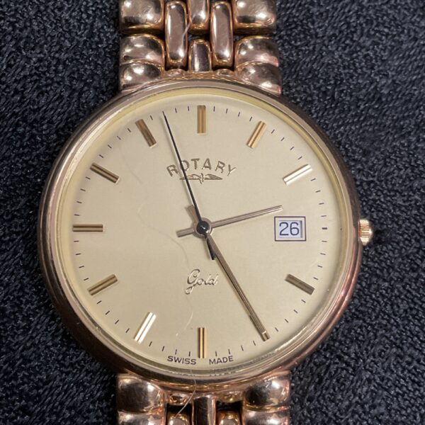 Close-up of the 9ct gold Rotary watch dial with date window.