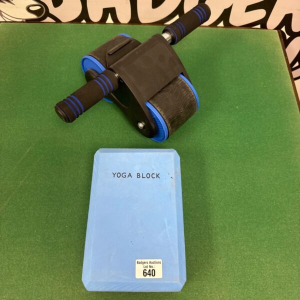 Abs roller and yoga block for core strength training.