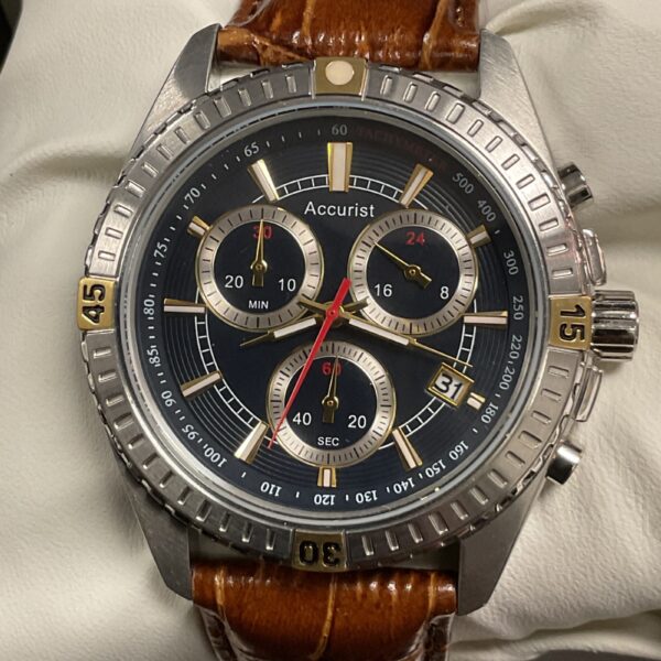 Close-up of an Accurist quartz wristwatch with a black dial.