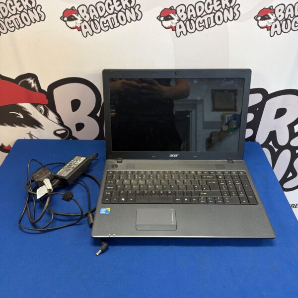 Used Acer Aspire laptop with charger included, side view.