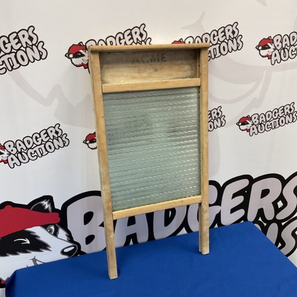 Vintage Acme wood and glass washboard for laundry cleaning.