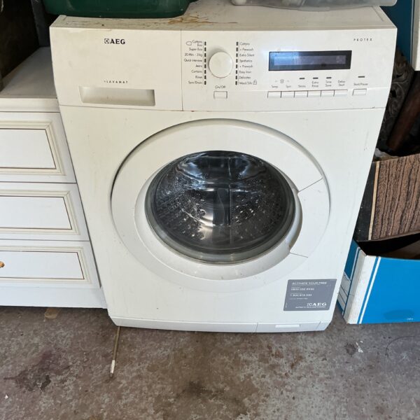 White AEG Protex washing machine with control panel visible.