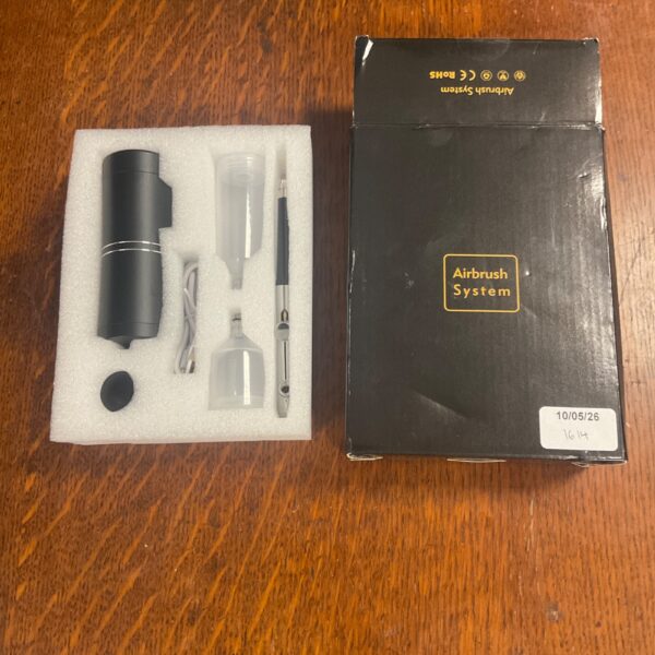 Unused airbrush kit with compressor for miniature painting.