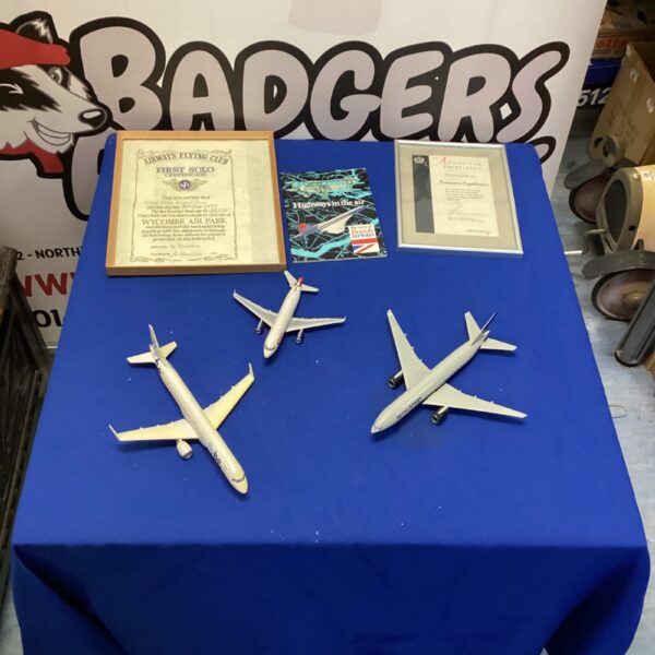 Airline memorabilia collection featuring model airplanes and certificates.