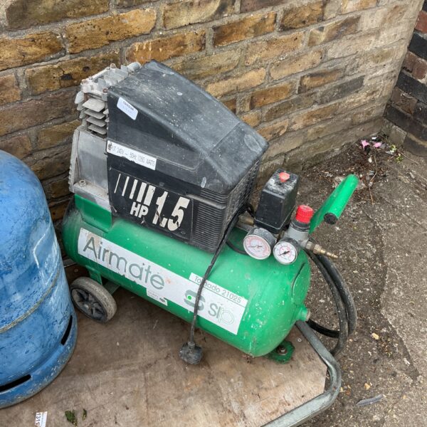 Green and grey Airmate compressor with 1.5HP motor.