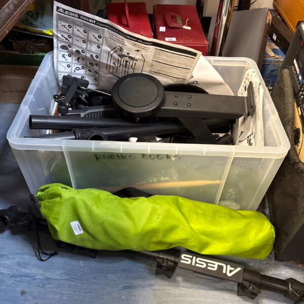 Used Alesis DM6KIT electronic drum set components in a box.