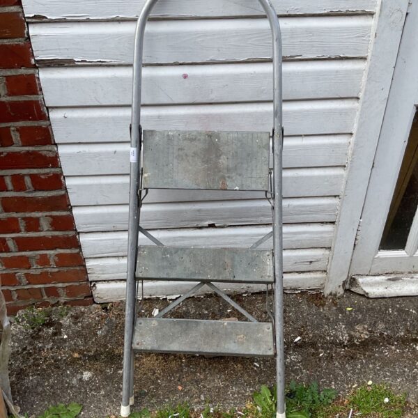 Vintage aluminium step ladder with three steps, ideal for garden use.