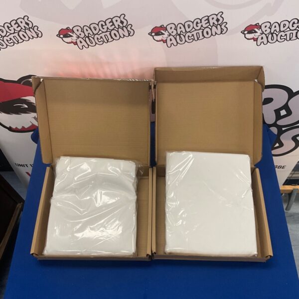 White Amazon Basics fitted sheets in unopened packaging.