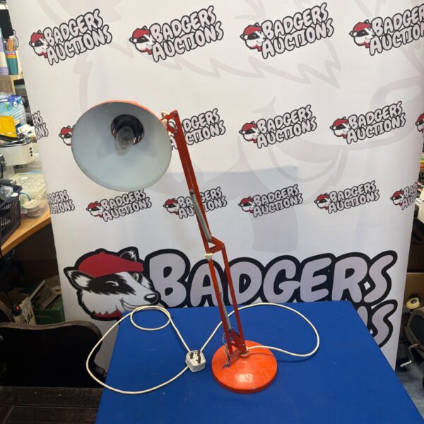 Vintage Herbert Terry Anglepoise Model 90 desk lamp with a red base.