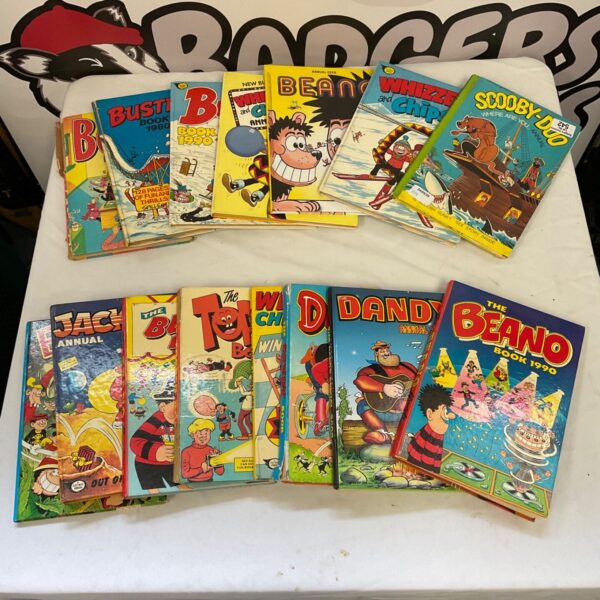 Vintage annuals collection featuring Beano, Dandy, and Scooby Doo comics.