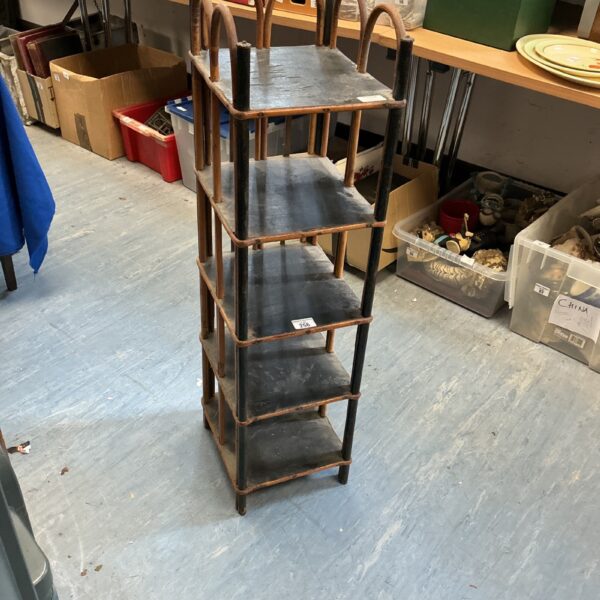 Antique bamboo slipper cabinet with tiered shelving, vintage hall furniture.