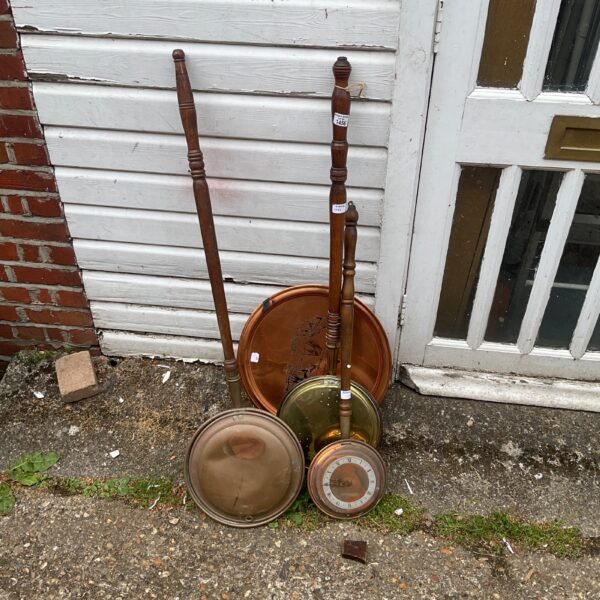 Antique copper bed warmers with wooden handles, a vintage lot.