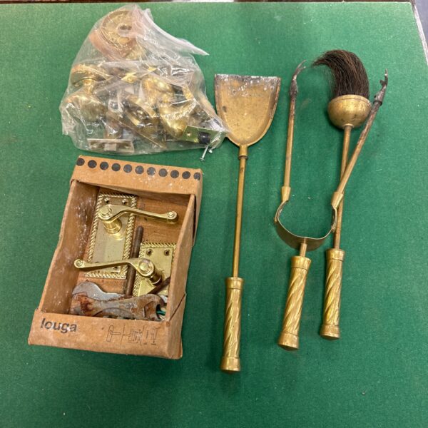 Antique brass fireside companion set with tools including poker and shovel.