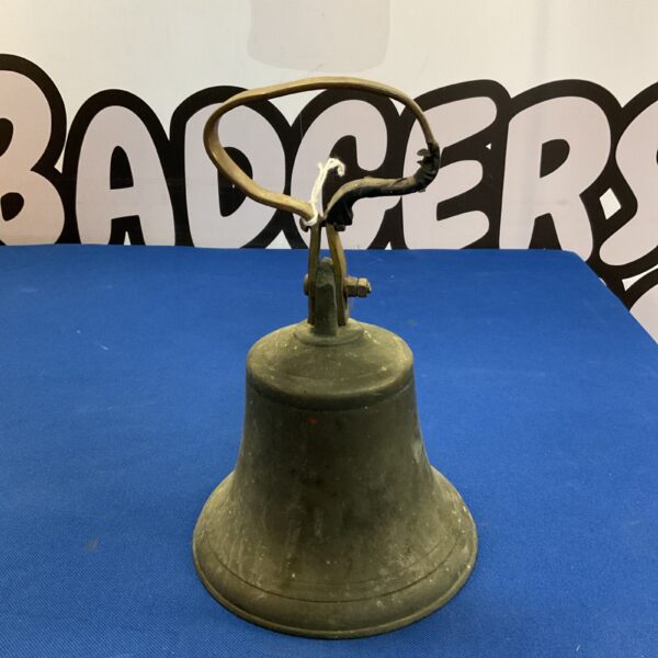 Antique bronze hand bell with a weathered patina.