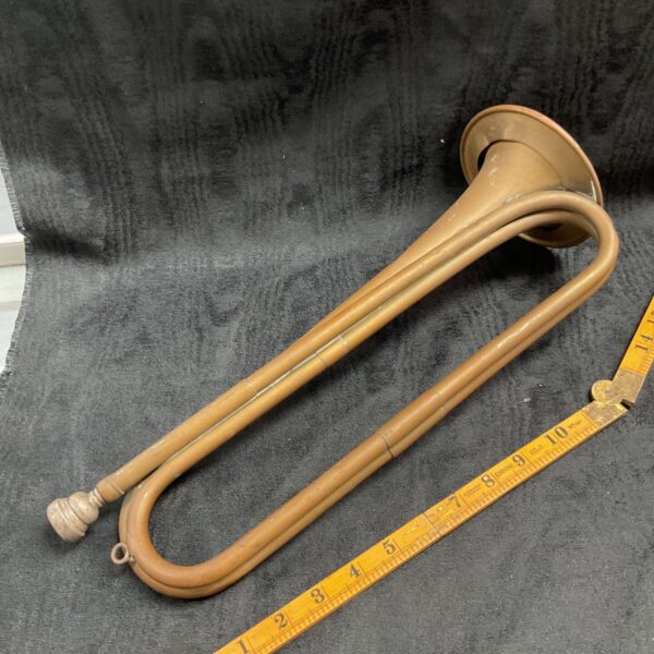 Antique brass bugle by Besson & Co, a vintage military instrument.