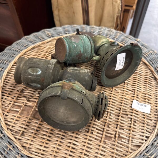 Pair of antique brass car lanterns, vintage automotive lighting.
