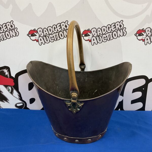 Antique copper bucket with wooden base and brass handle.