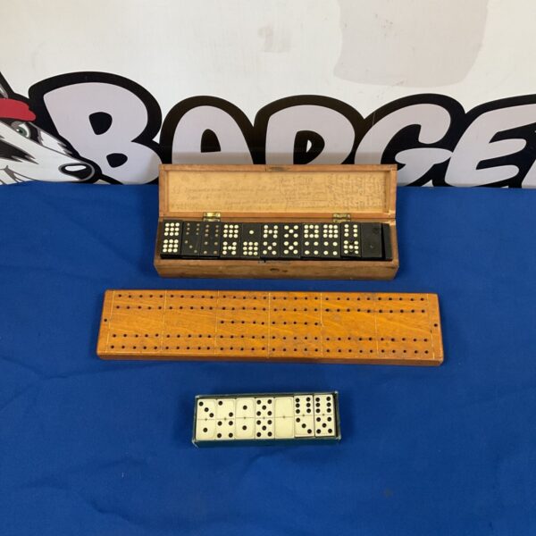 Antique dominoes and cribbage board set in wooden box.