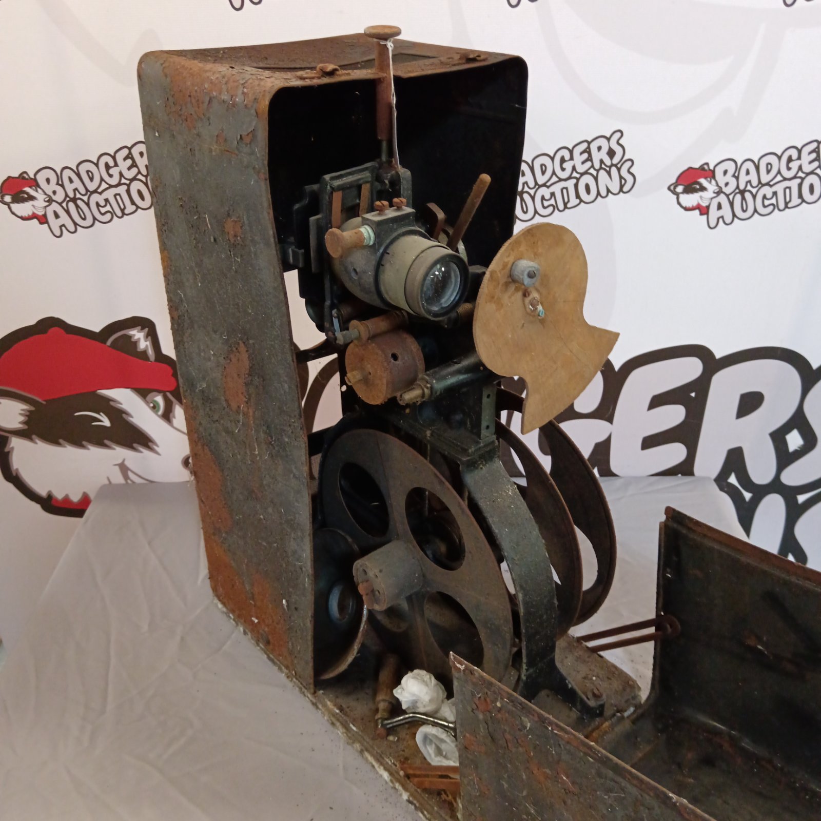 Antique hand cranked film projector, vintage movie equipment.
